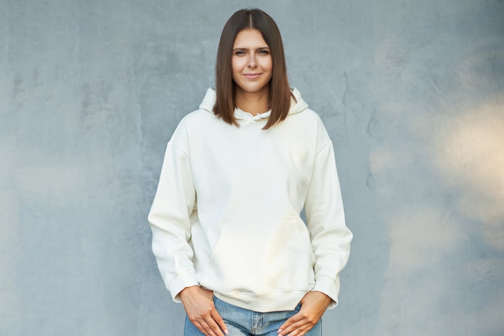 Young Woman in White Hoodie.